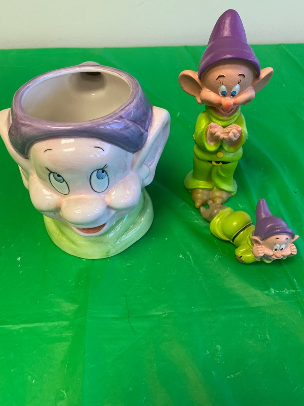 Disney Ceramic Figure with Purple Accent and Green Backdrop